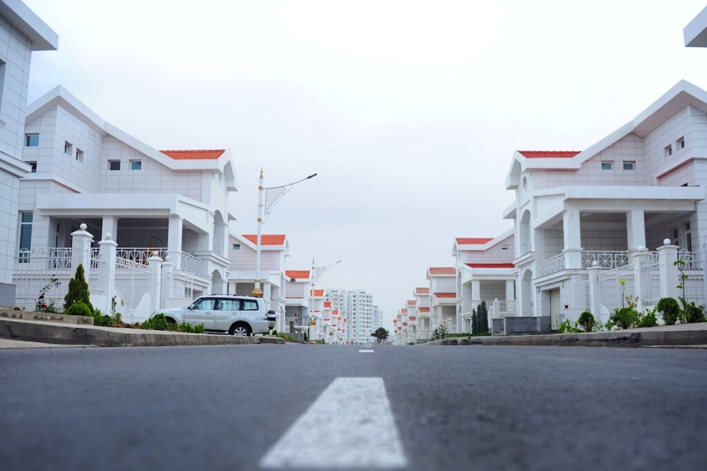 pexels-photo-1475938-1 Modern luxury houses line a calm street in Ashgabat, Turkmenistan.